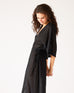 profile of woman showcasing black mersea breezy light kaftan dress
