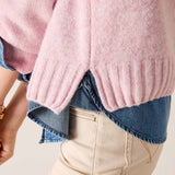 Bliss pink raglan sweater with a ribbed hem and soft knit texture.