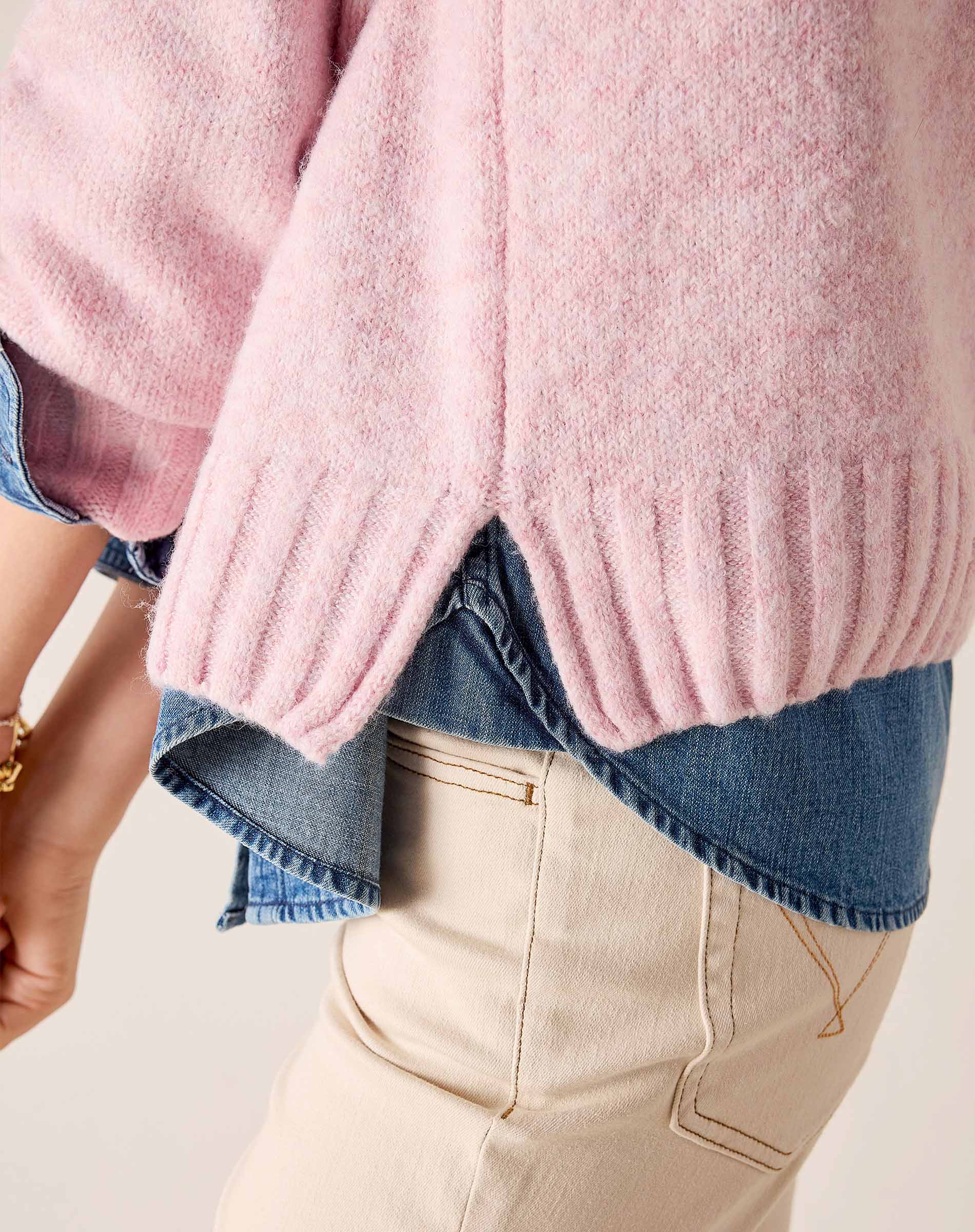 Bliss pink raglan sweater with a ribbed hem and soft knit texture.