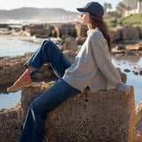 Ladies' travel-ready dove gray raglan knit sweater with a relaxed fit and dropped shoulders.