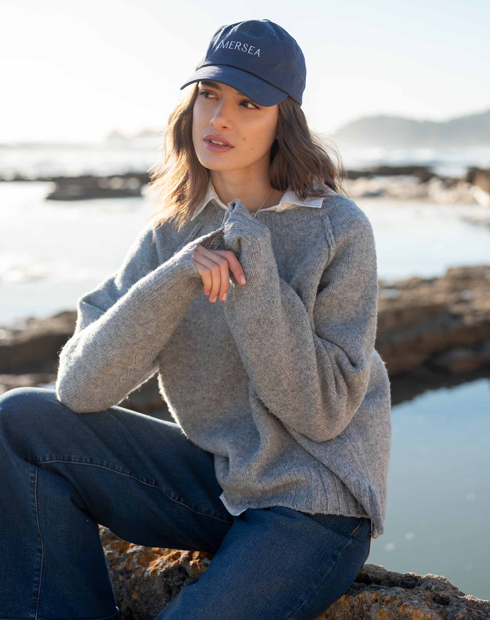 Dovetail grey raglan sweater with a soft knit texture and drop shoulder design.
