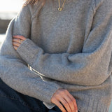Dove gray raglan sweater in a soft knit texture.