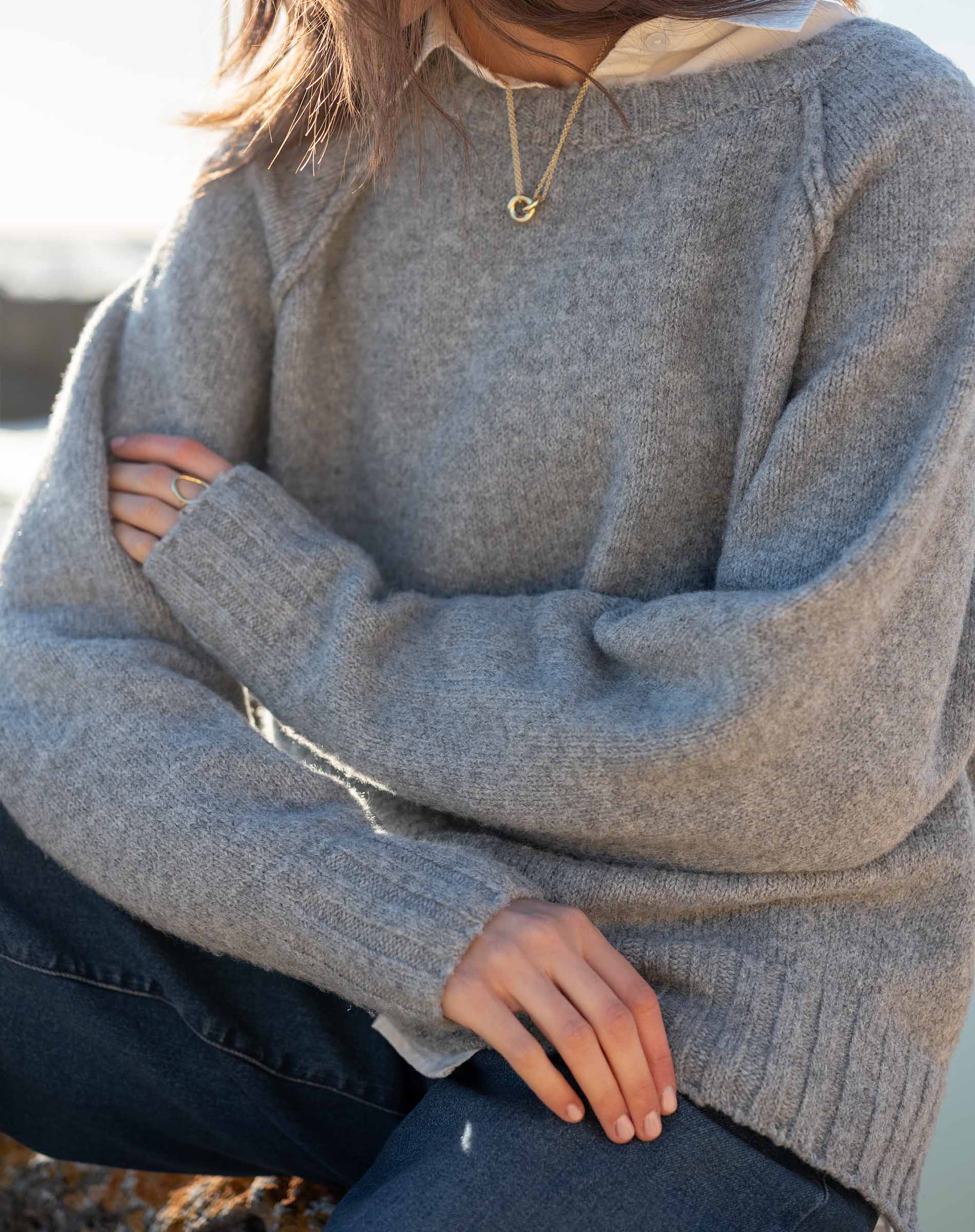 Dove gray raglan sweater in a soft knit texture.