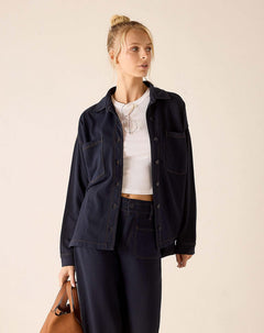 Navy blue relaxed fit cotton boyfriend jacket with button front and chest pockets.