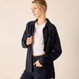 Navy blue oversized boyfriend jacket in soft cotton blend with front pockets.