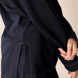 Navy blue boyfriend jacket with ribbed texture and contrast stitching.