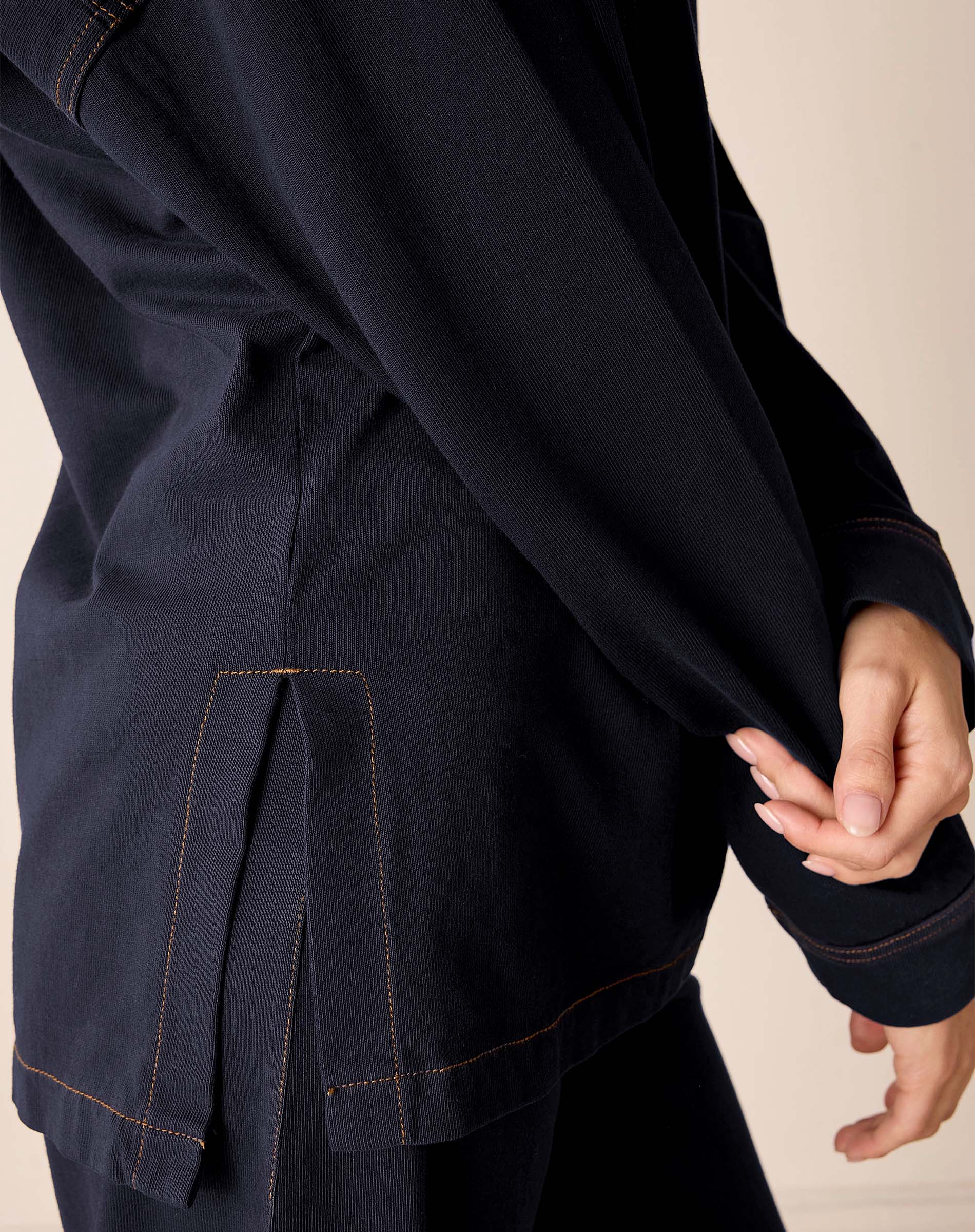 Navy blue boyfriend jacket with ribbed texture and contrast stitching.
