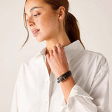 White button-up linen shirt with ruffled cuffs.