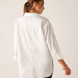White oversized button-up linen shirt with gathered sleeve details