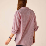 Back view of the pink and white pinstripe long-sleeve shirt with rolled sleeves.