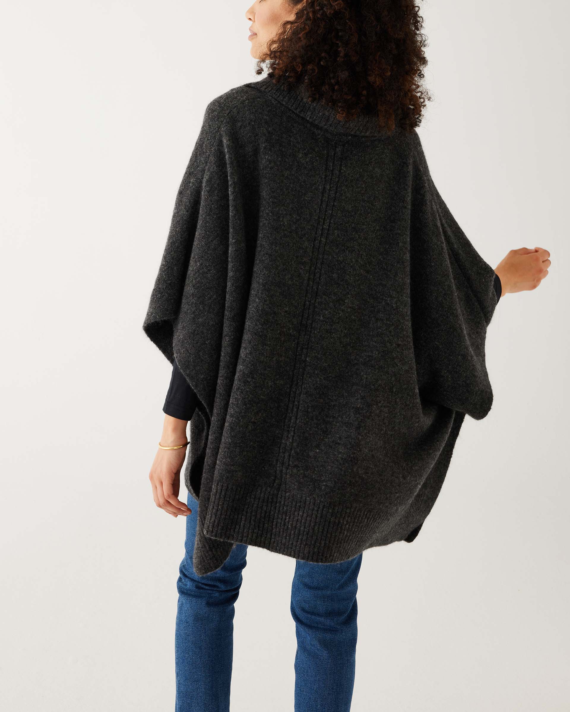 rearview of woman wearing mersea cambridge collar poncho in black