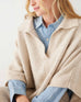 closeup of woman wearing mersea cambridge collar poncho in oatmeal beige