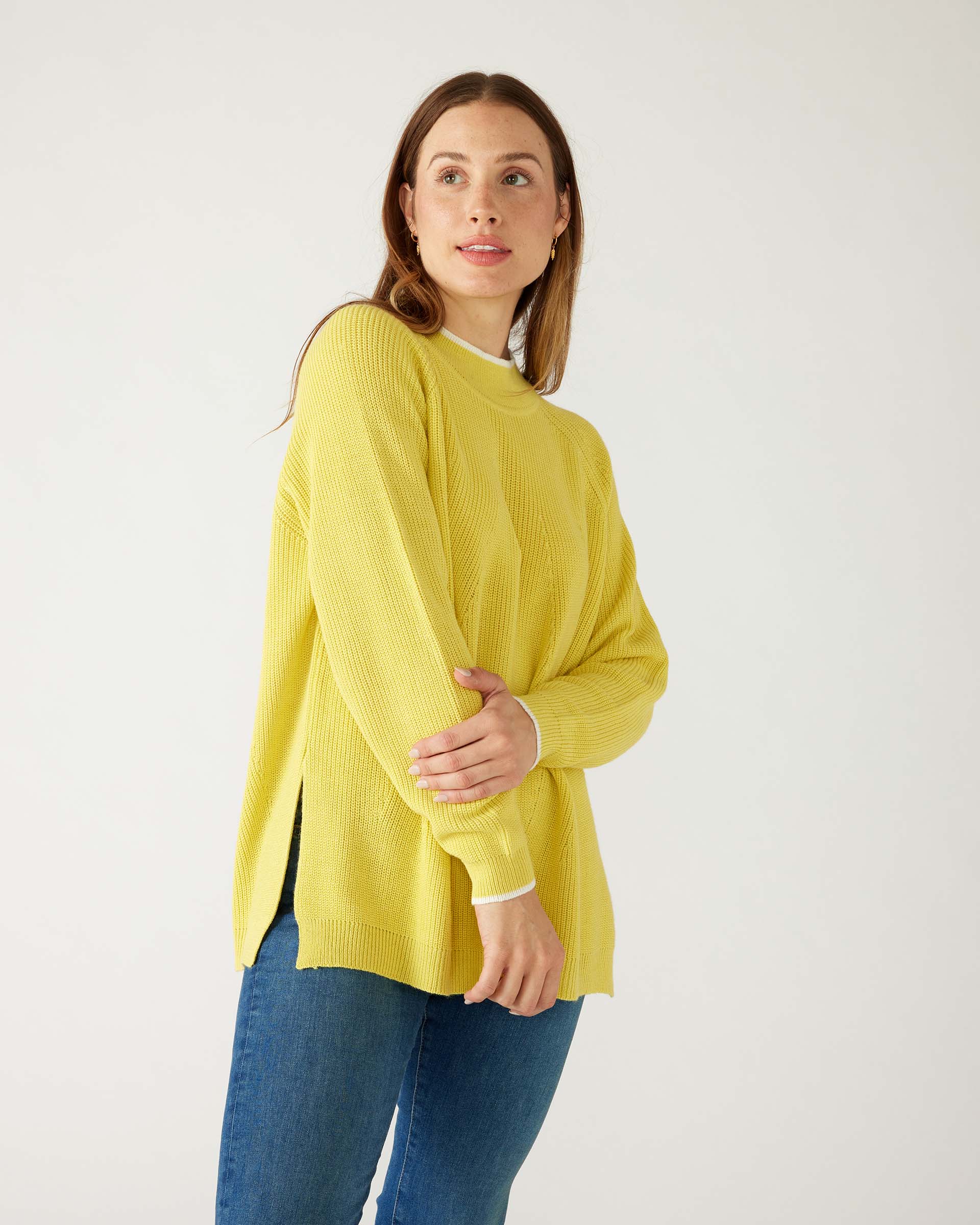 woman wearing mersea camden mockneck sweater in sunbeam yellow