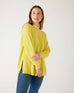 woman wearing mersea camden mockneck sweater in sunbeam yellow