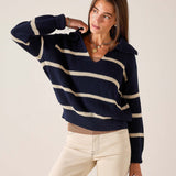 Navy and cream striped ribbed knit sweater with a boat neck and wide sleeves.
