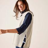Desert palm textured knit vest in cream with a ribbed design.