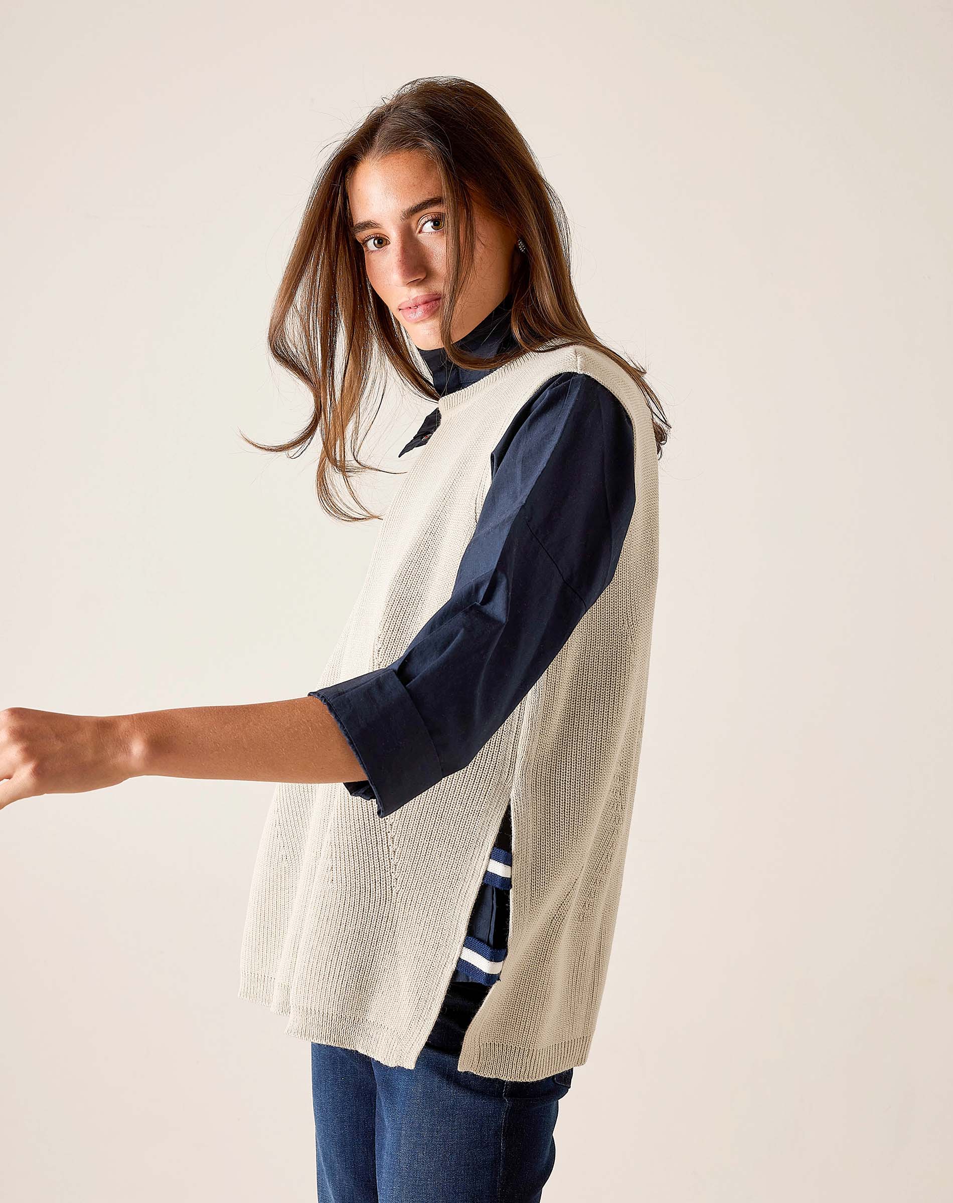 Desert palm textured knit vest in cream with a ribbed design.