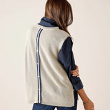 Side view of women's travel-friendly desert palm knit vest with a buttoned side seam and navy blue accents.