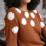 Cinder brown cashmere sweater featuring white camellia flower embroidery.