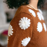 Cinder knit sweater featuring ivory camellia floral embroidery.