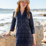Crochet block navy dress with three-quarter sleeves and button details.