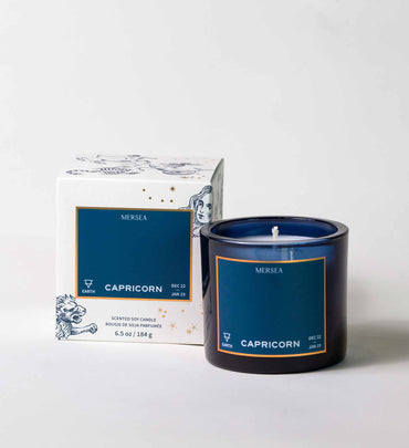 blue capricorn candle with box on a white background