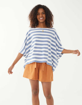 female wearing blue and white striped terry slouch tee standing on a white background