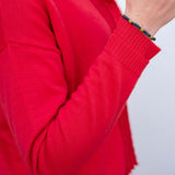 Chili red knit cardigan with ruffled detail