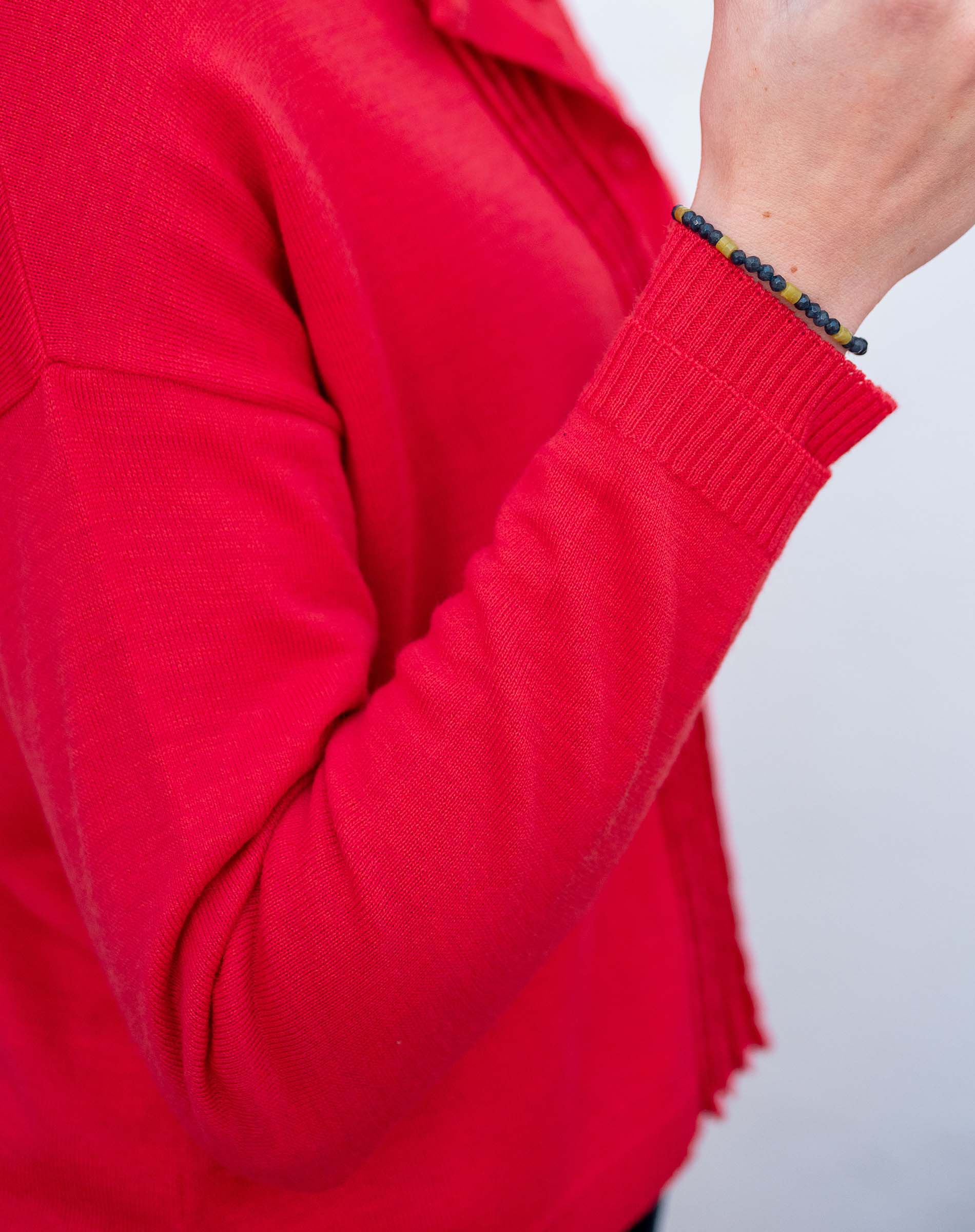 Chili red knit cardigan with ruffled detail