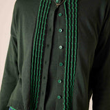 Pine green button-down knit cardigan with ruffled trim and buttons.