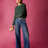 Pine green knitted ruffle cardigan with a textured striped detail on the front.