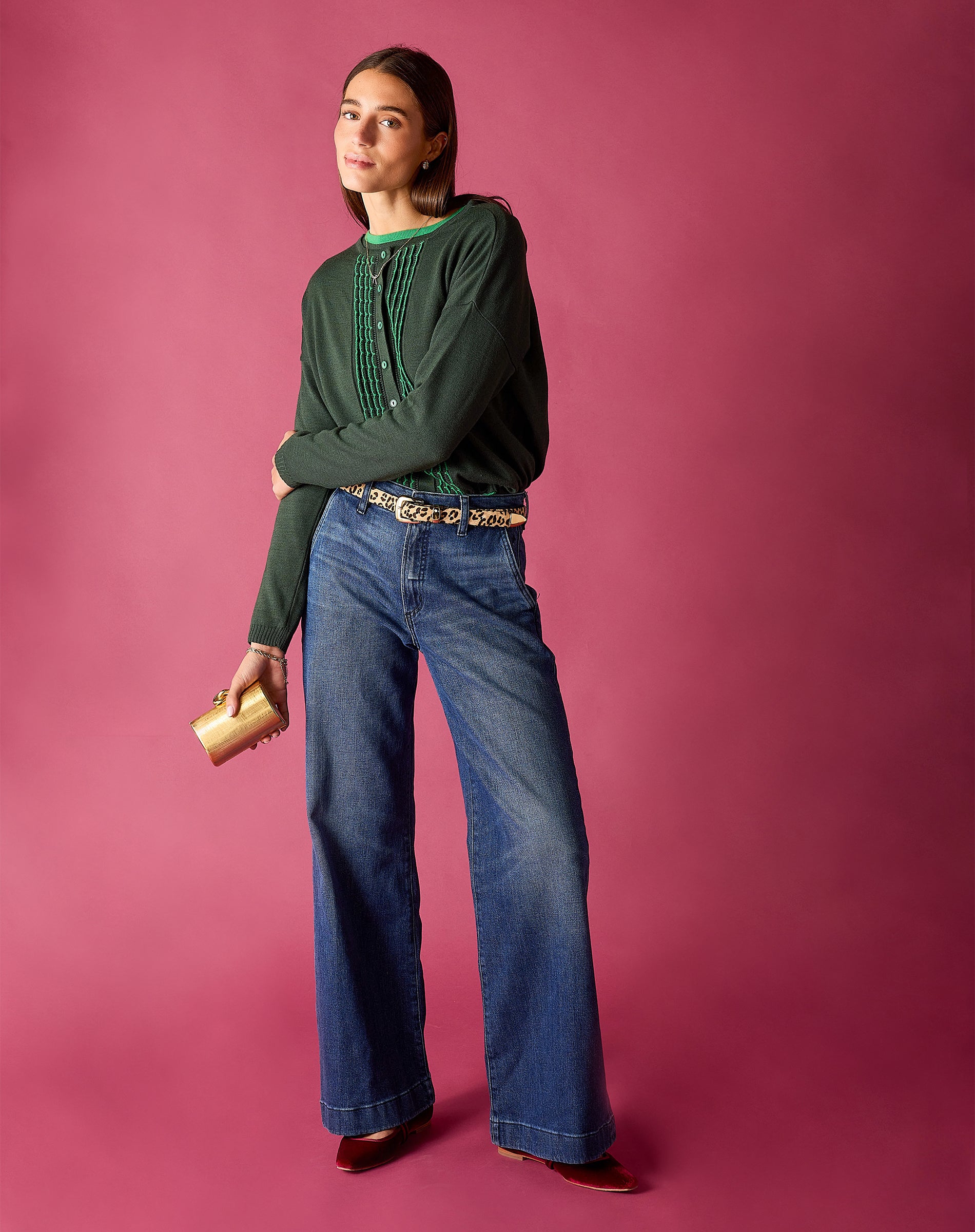 Pine green knitted ruffle cardigan with a textured striped detail on the front.