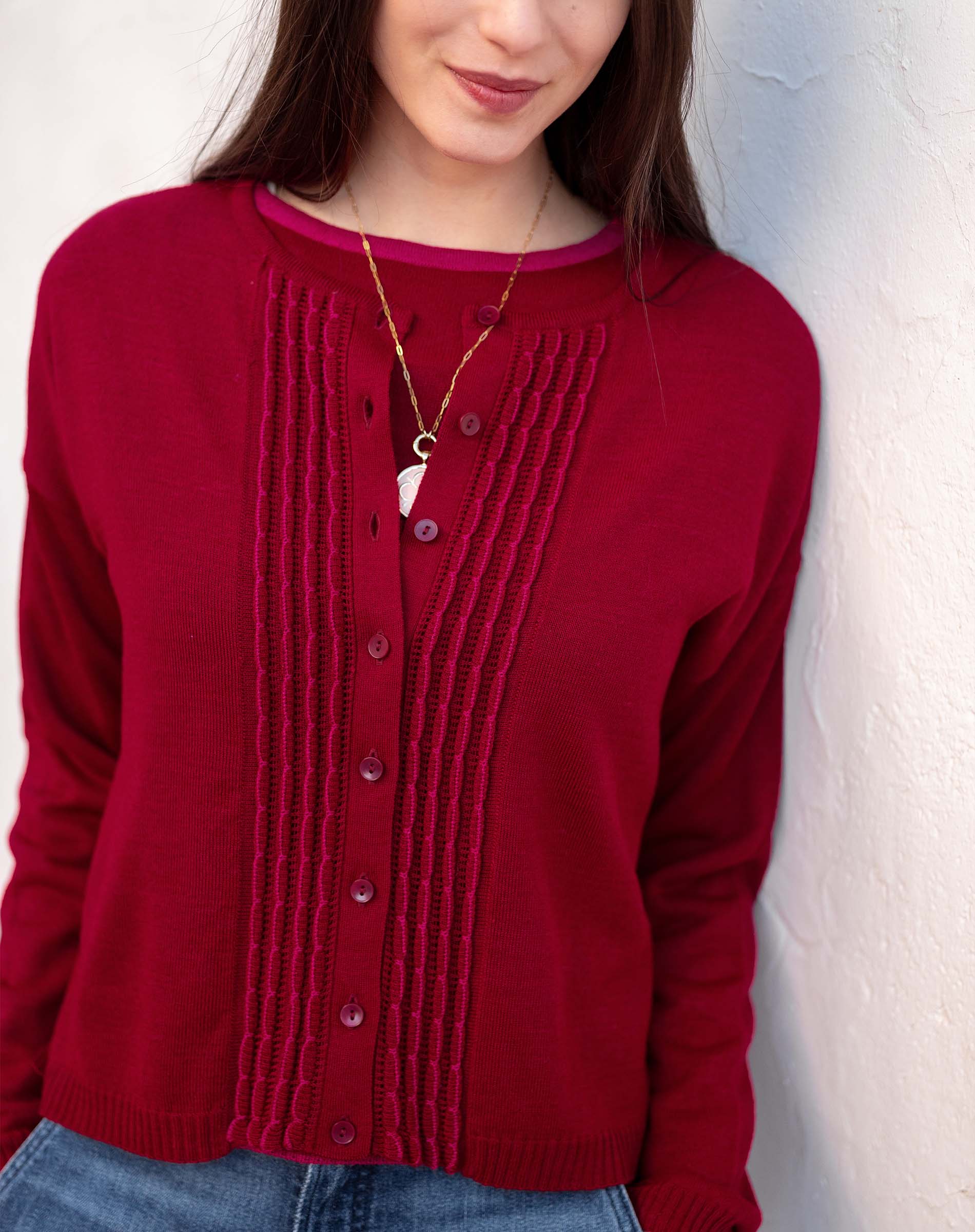 Ladies' travel-ready wine red ribbed knit cardigan with button front and textured vertical stripe detailing.