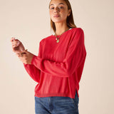 Chili red knit sweater with long sleeves and a relaxed fit.