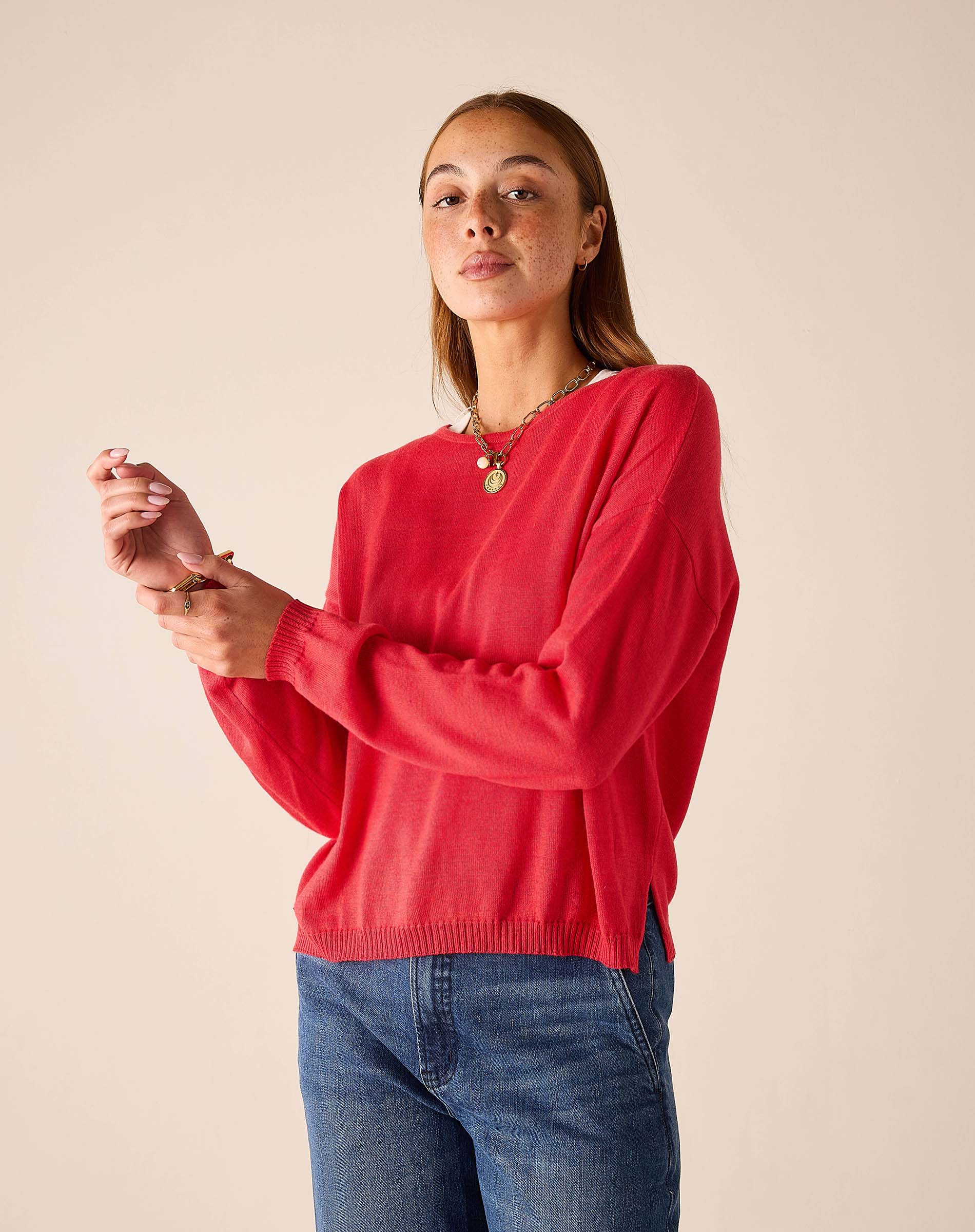Chili red knit sweater with long sleeves and a relaxed fit.