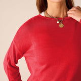 Chili red knit sweater with a crew neck and long sleeves.
