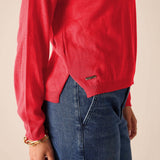 Chili red knit sweater with a ribbed hem and long sleeves.