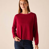 MERSEA women's travel-friendly wine red knit sweater with long sleeves and a rounded neckline.