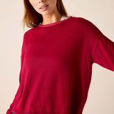 Wine knit sweater with a crew neck and ribbed hem.