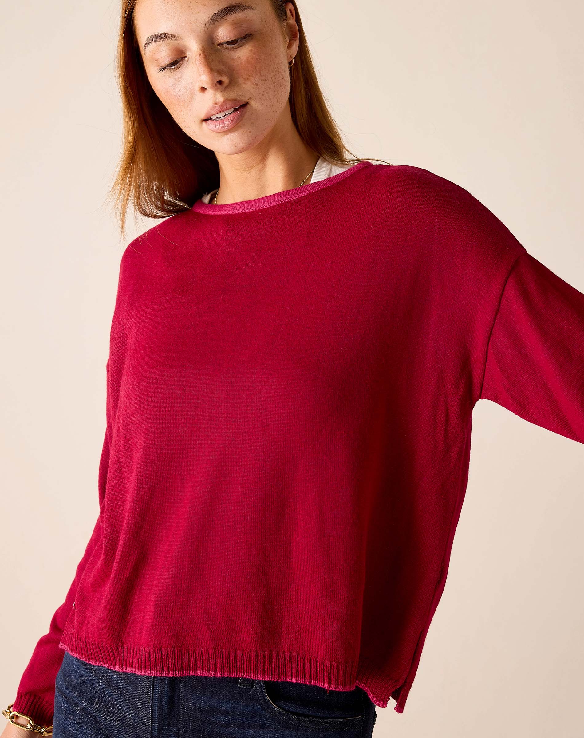 Wine knit sweater with a crew neck and ribbed hem.
