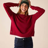 Wine knit sweater with a round neck and long sleeves.