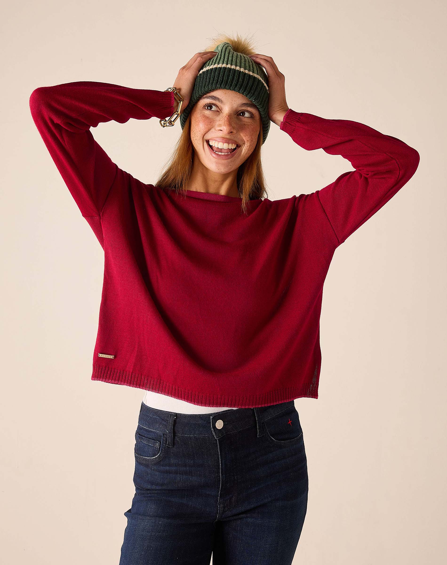 Wine knit sweater with a round neck and long sleeves.