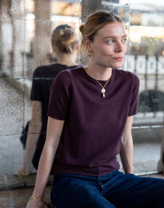 Plum cashmere short-sleeved sweater with a soft knit texture.