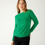 woman wearing mersea carmel sweater in jade