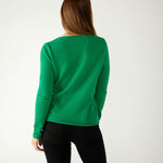 rear view of woman wearing mersea carmel sweater in jade