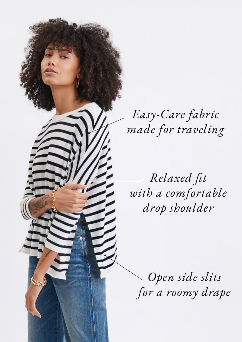 Female wearing a navy and white striped tee. Features details: easy care, relaxed fit and open side slits.