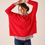 Women's travel-friendly scarlet red knit cashmere pullover with wide sleeves.