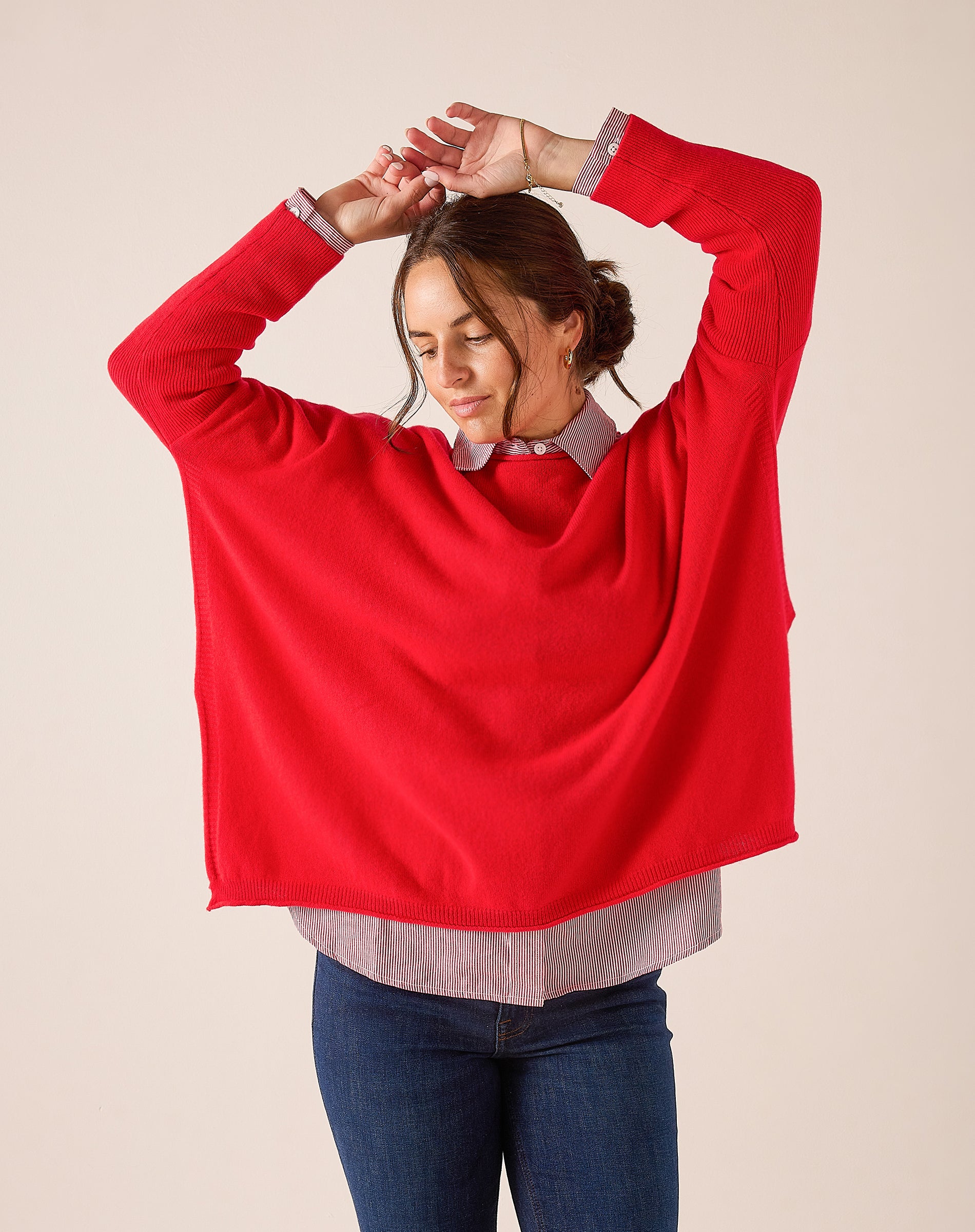 Women's travel-friendly scarlet red knit cashmere pullover with wide sleeves.