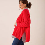 Scarlet red oversized cashmere sweater with dropped shoulders and side slits.