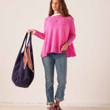 Women's travel-friendly sugar pink relaxed-fit cashmere knit sweater with a wide neckline.